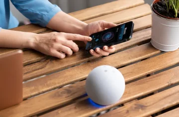 iPhone scanning NFC tag for smart home control and digital device interaction