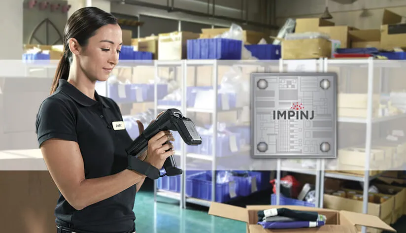 Warehouse Worker Using a Handheld RFID Scanner with an Impinj Chip Graphic Overlay