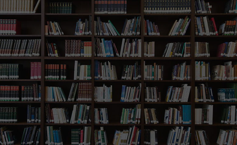 Event & Access Management Large Wooden Bookshelf Packed with Books in a Library
