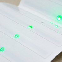 White RFID Tags with Glowing Green LED Indicators