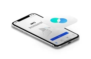 A smartphone displaying an NFC scanning application interface with a floating card icon above it.