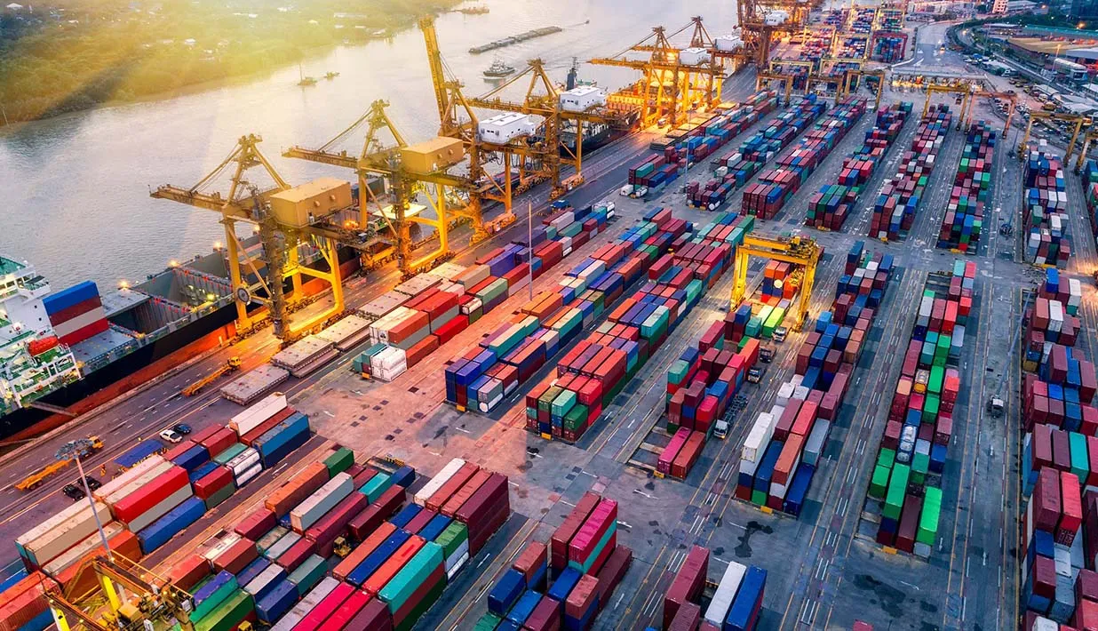 EPC Gen2v2 vs ISO 18000 6C A Logistics Scenario Compatibility Comparison An aerial view of a bustling container port terminal with colorful shipping containers and large cranes
