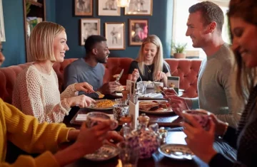 "Group of friends enjoying a meal together at a restaurant."