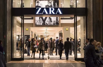 Zara store front with people walking in and out of the entrance.