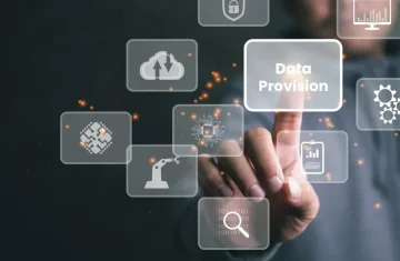 Hand touching a digital interface button labeled Data Provision with technology icons in the background.