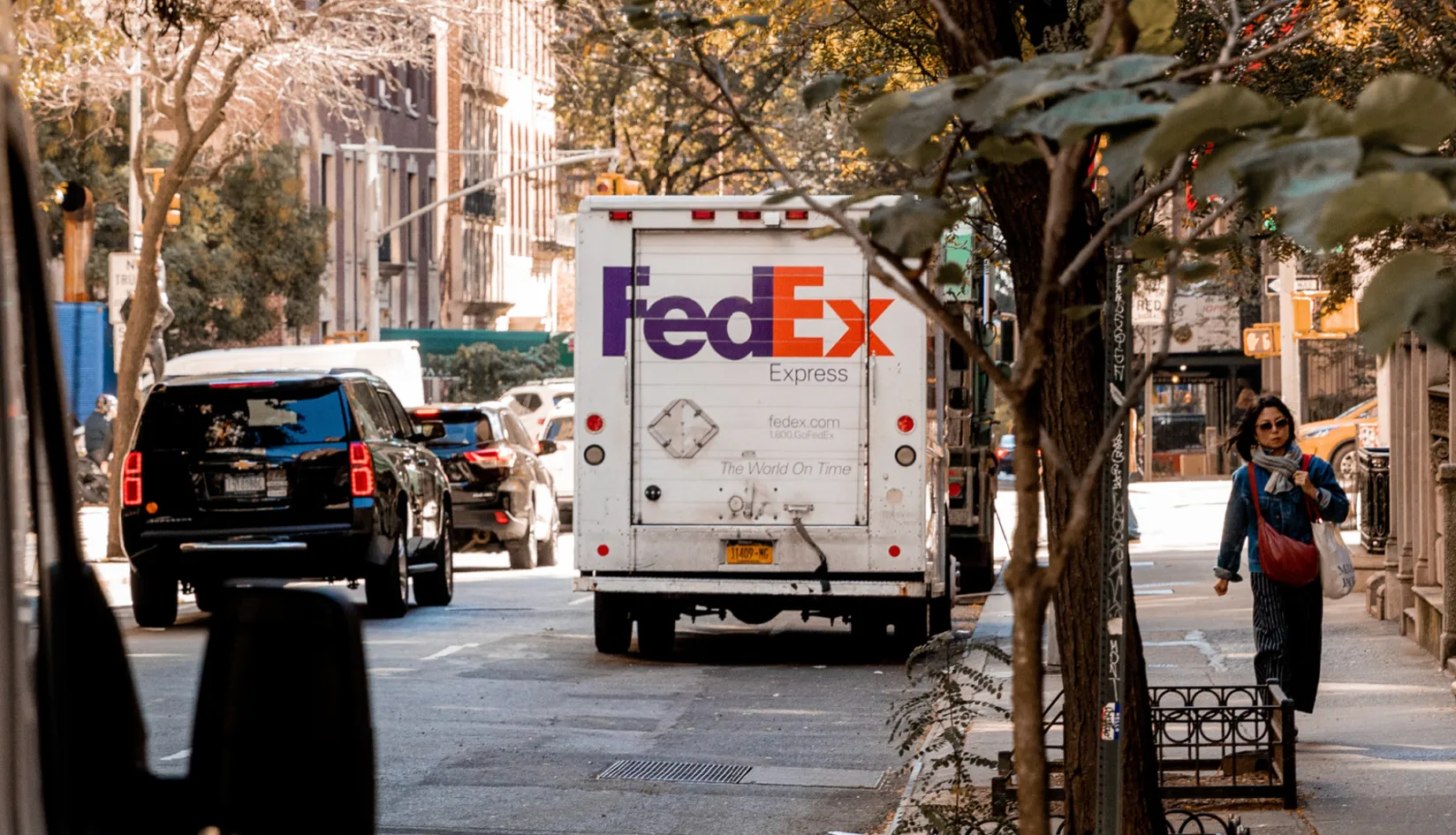 FedEx delivery truck on a city street, representing RFID enabled logistics and shipment visibility.