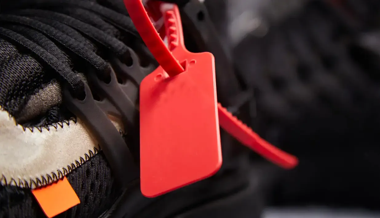 Red RFID tag attached to a black tire showing asset tracking identification technology.